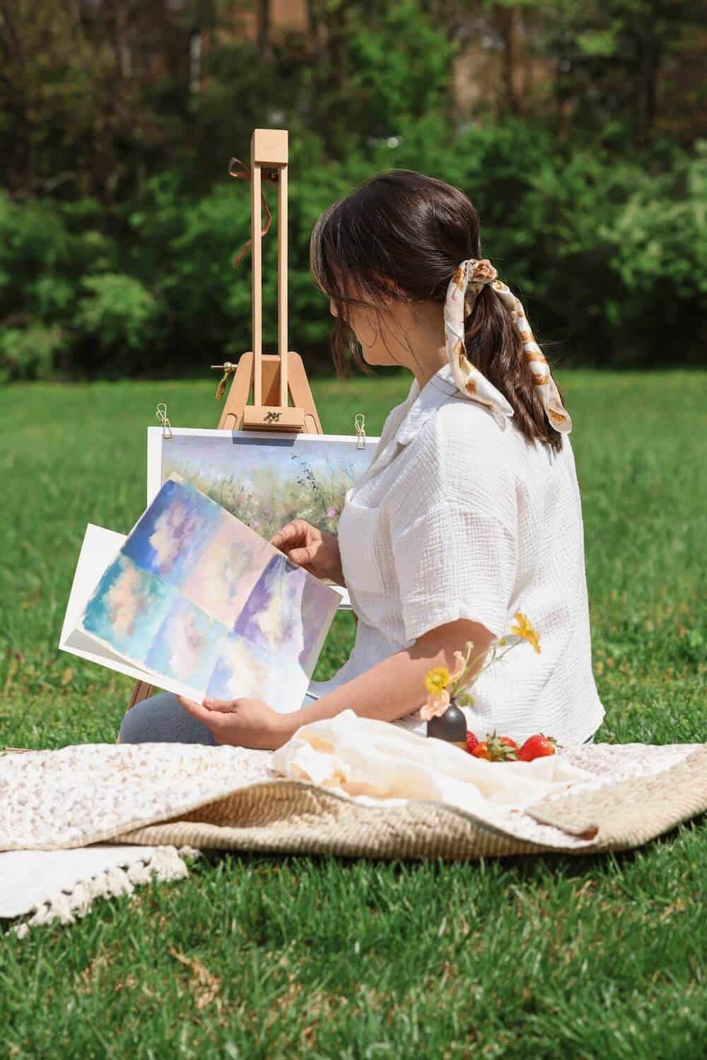 Women painting outdoors at easels