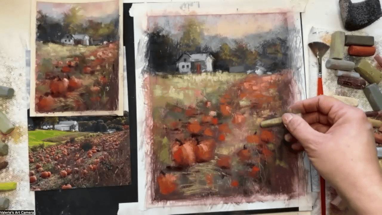 Hand painting a soft pastel autumn landscape of a farmhouse in a pumpkin field