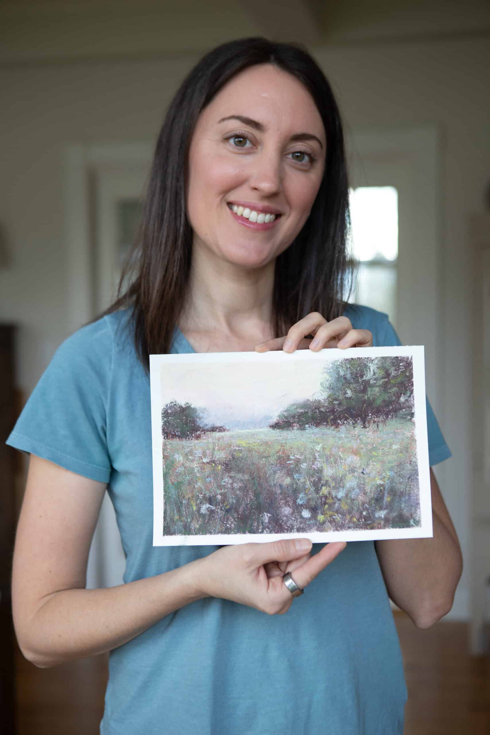 Robin holding her soft pastel meadow landscape